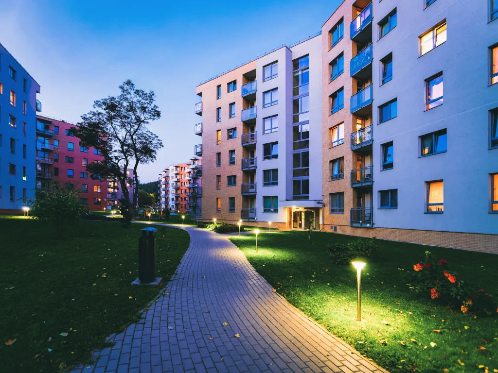 Property lease-up apartment complex at dusk
